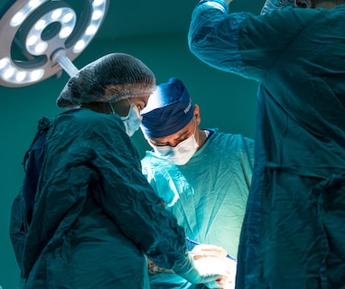 a group of doctors performing surgery on a patient